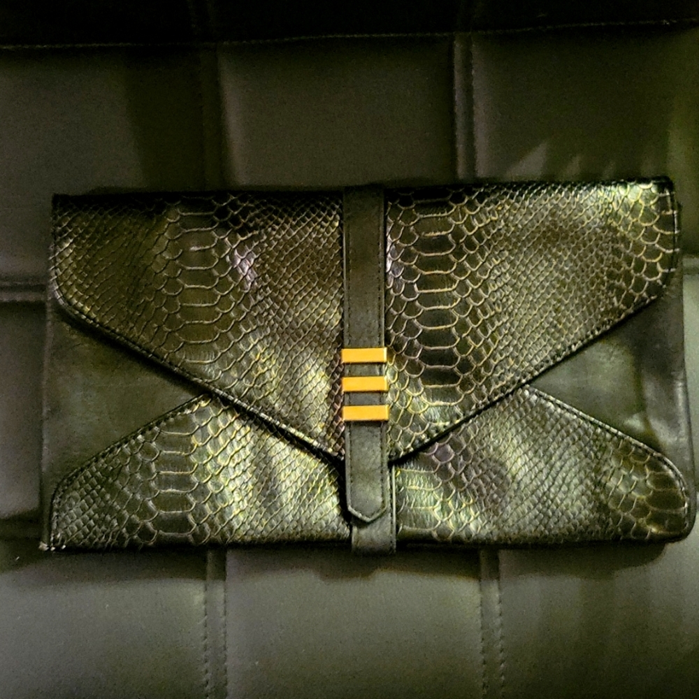 Black and gold synthetic animal print clutch